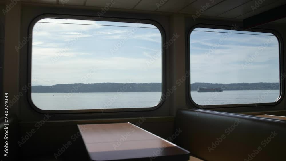 Walking shot of empty booths in a Washington State ferry on a sunny day. Walking shot of empty booths in a Washington State ferry on a sunny day.
