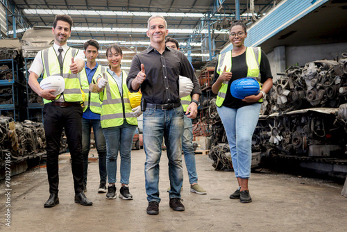 Industrial workers standing together at manufacturing plant industry factory. Professional engineer team full skill quality at workplace. Workers, technicians and manager ready to start operation.