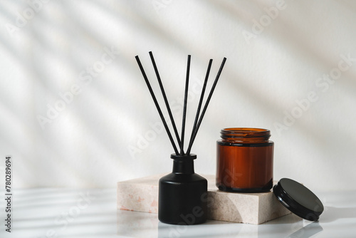 Elegant Aroma Diffuser With Black Reeds on a Marble Stand in Soft Daylight © fotofabrika