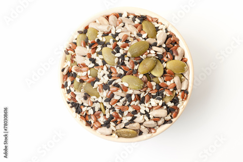 Mixed seeds sunflower, black and white sesame, flax and pumpkin in bowl on white background. Top view