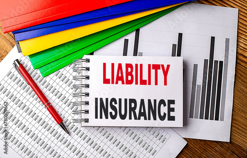 LIABILITY INSURANCE text on notebook with folder on chart