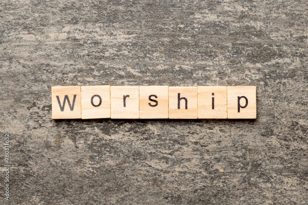 Fototapeta premium Worship word written on wood block. Worship text on cement table for your desing, concept
