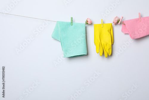 Rubber gloves with flowers on a rope