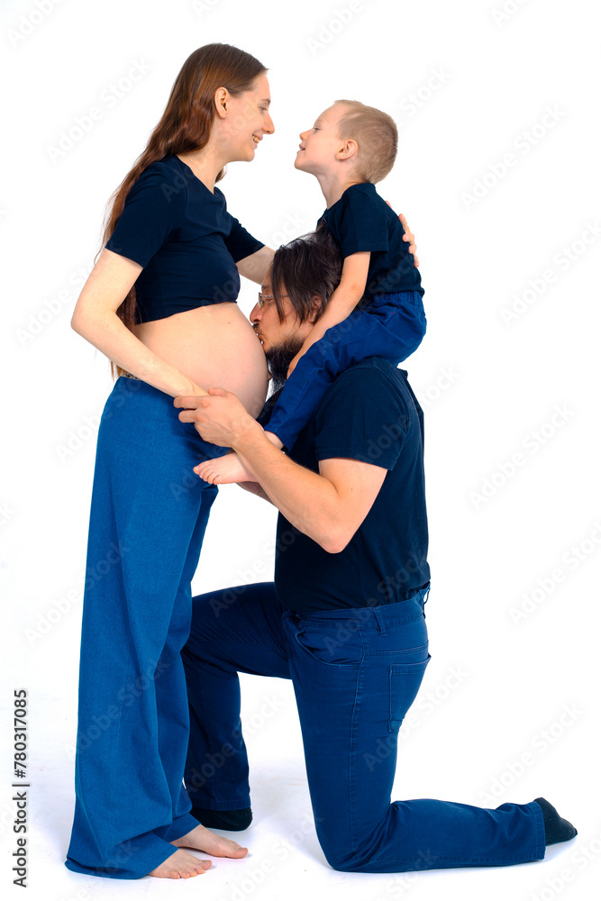 beautiful european happy family with a pregnant mother, the father and a son together. High quality photo
