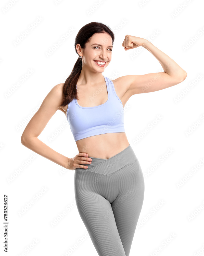 Happy young woman with slim body showing muscles on white background Happy young woman with slim body showing muscles on white background