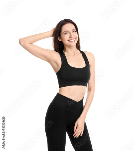 Happy young woman with slim body posing on white background