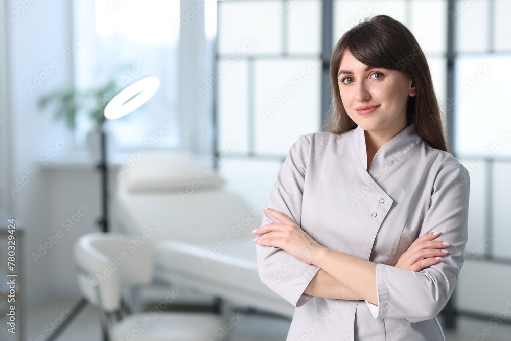 Cosmetologist in medical uniform in clinic, space for text Cosmetologist in medical uniform in clinic, space for text