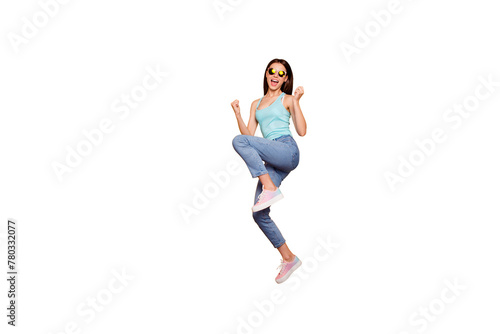 Full body length size studio photo portrait of glad positive bright vivid shine with open mouth optimistic lovely she her lady jumping up raising fists isolated vibrant background