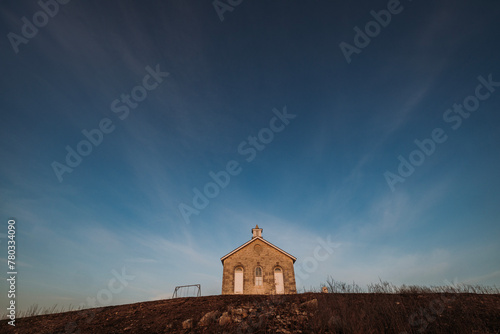 One room school sits alone on a hilltop, Kansas prairie photo