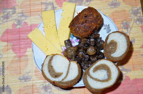 Plate with bread, champignons, cheese and cutlet.