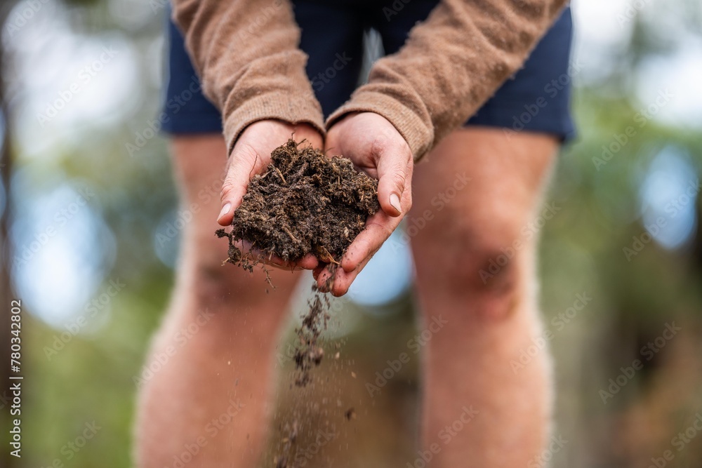 agronomist on a farm practicing agronomy holding soil, doing soil tests in her home laboratory. Looking at soil life and health agronomist on a farm practicing agronomy holding soil, doing soil tests in her home laboratory. Looking at soil life and health
