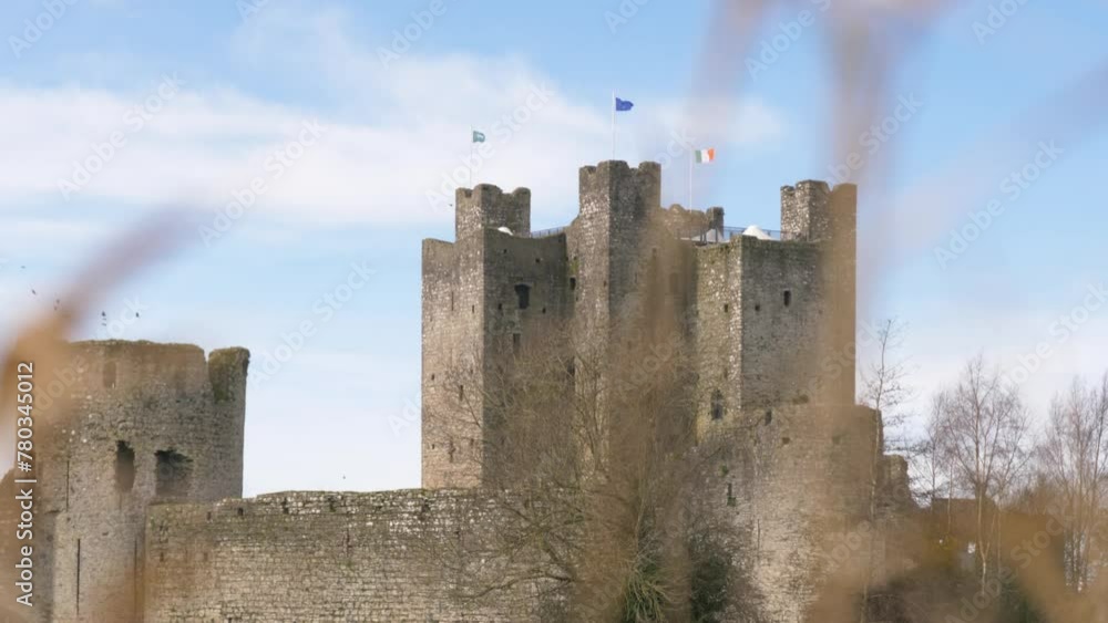 Anglo-Norman Fortification Of Trim Castle In South Riverbank Of Boyne In Trim, County Meath, Ireland. Reveal Shot Anglo-Norman Fortification Of Trim Castle In South Riverbank Of Boyne In Trim, County Meath, Ireland. Reveal Shot