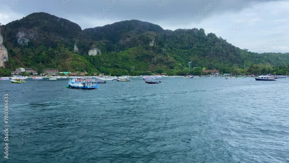 Many boats anchored in Phi Phi islands bay. Tourism in Thailand Many boats anchored in Phi Phi islands bay. Tourism in Thailand