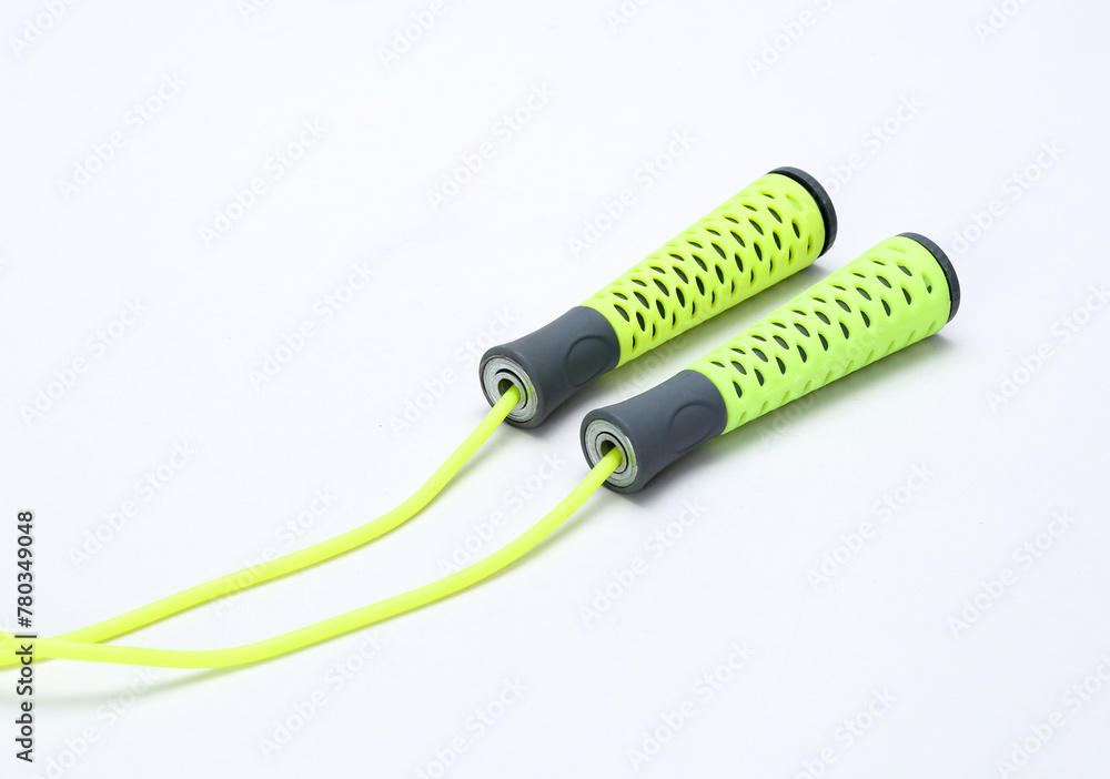 Green skipping rope for an exercise, isolated on white Green skipping rope for an exercise, isolated on white