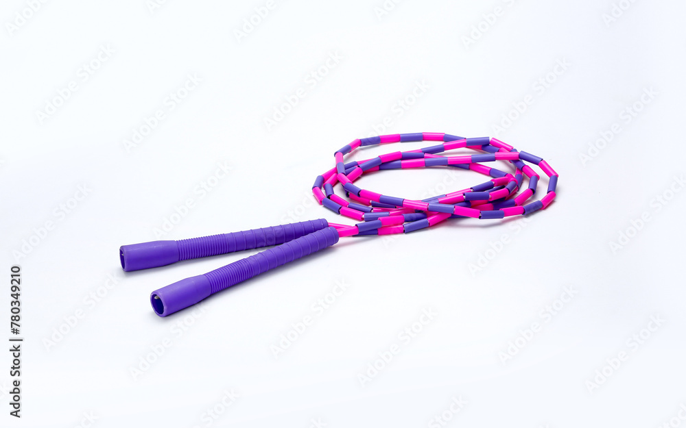 purple and pink skipping rope isolated on white background purple and pink skipping rope isolated on white background