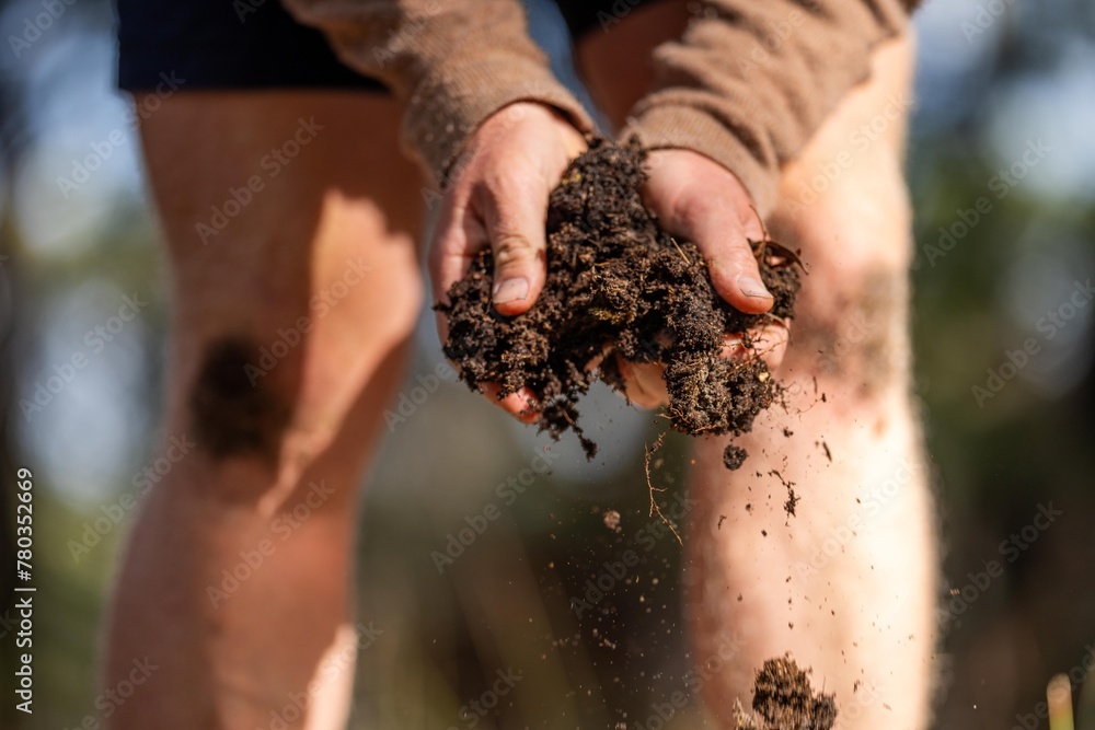 farmer hold soil in hands monitoring soil health on a farm. conducting soil tests farmer hold soil in hands monitoring soil health on a farm. conducting soil tests