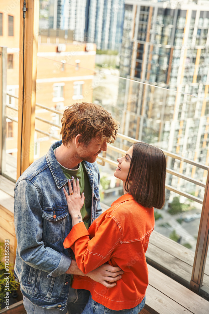 A man and a woman standing side by side, exuding warmth and unity in their body language A man and a woman standing side by side, exuding warmth and unity in their body language