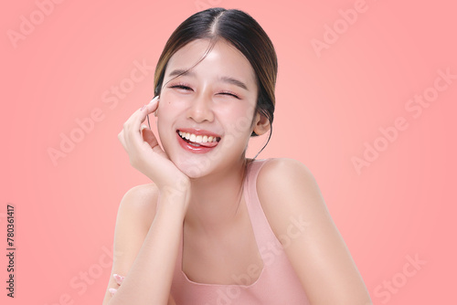 Close-up portrait of young Asian beautiful woman with K-beauty make up style and healthy and perfect skin isolated on pink background for skincare commercial product advertising.