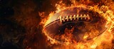 An American football engulfed in flames