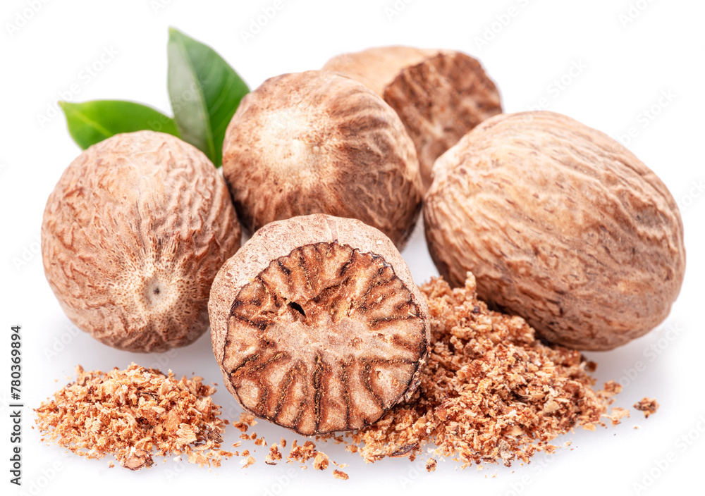 Nutmeg and ground nutmeg heap isolated on white background. Nutmeg and ground nutmeg heap isolated on white background.