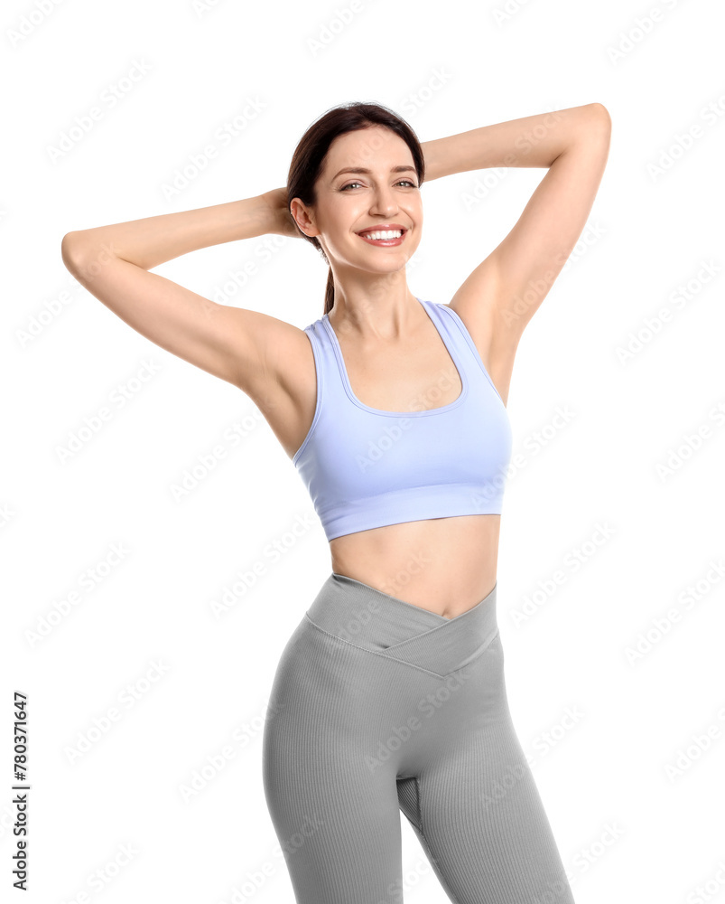 Happy young woman with slim body posing on white background