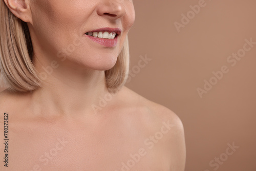 Woman with healthy skin on beige background  closeup