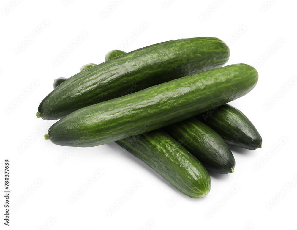 Many long fresh cucumbers isolated on white Many long fresh cucumbers isolated on white