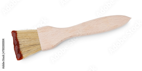 Marinade with basting brush isolated on white, top view