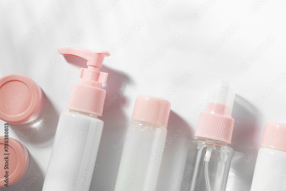 Cosmetic travel kit on white background, top view Cosmetic travel kit on white background, top view