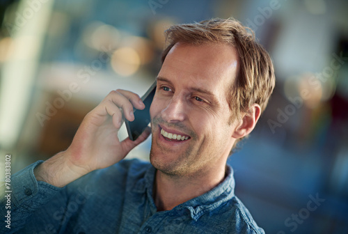Businessman, phone call and talking with smile in office, chatting or speaking with mobile in workplace. Technology, cellphone and happy man on smartphone in discussion, business deal or conversation