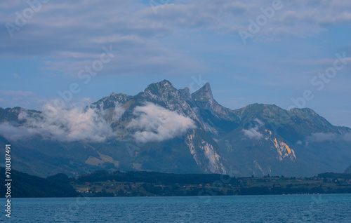 Aeiral panorama of Niesen mountain, also called as Swiss Pyramid with reflection on the Thun lake