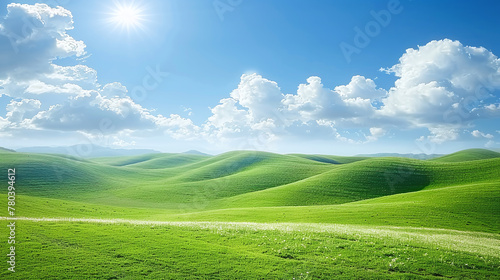 hilly landscape with green grass and blue sky 