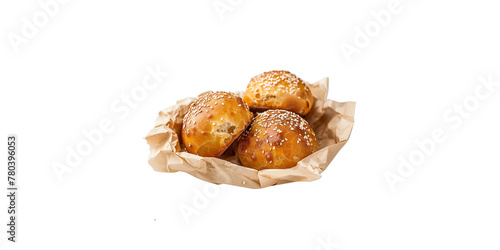
Sesame balls, round fried dumplings with sesame seeds inside in brown paper basket isolated on white background