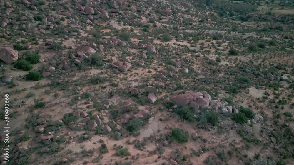 Drone shot of a landscape with mountains under cloudy sky Drone shot of a landscape with mountains under cloudy sky