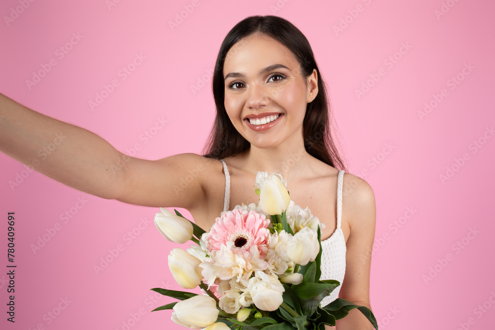 Lady taking a selfie with pink flowers Lady taking a selfie with pink flowers