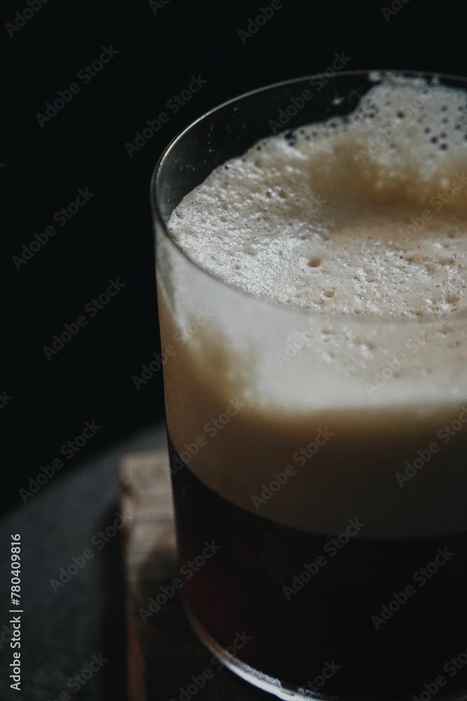 Vertical closeup of a glass of shaken coffee. Vertical closeup of a glass of shaken coffee.
