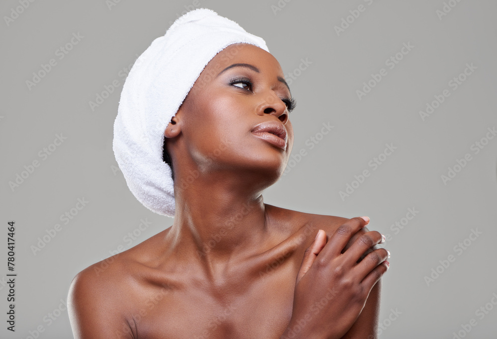 Black woman, glow and cosmetics with dermatology, shine and healthy skin on white studio background. Glow, African person and model with wellness and towel with makeup, spa treatment and aesthetic Black woman, glow and cosmetics with dermatology, shine and healthy skin on white studio background. Glow, African person and model with wellness and towel with makeup, spa treatment and aesthetic