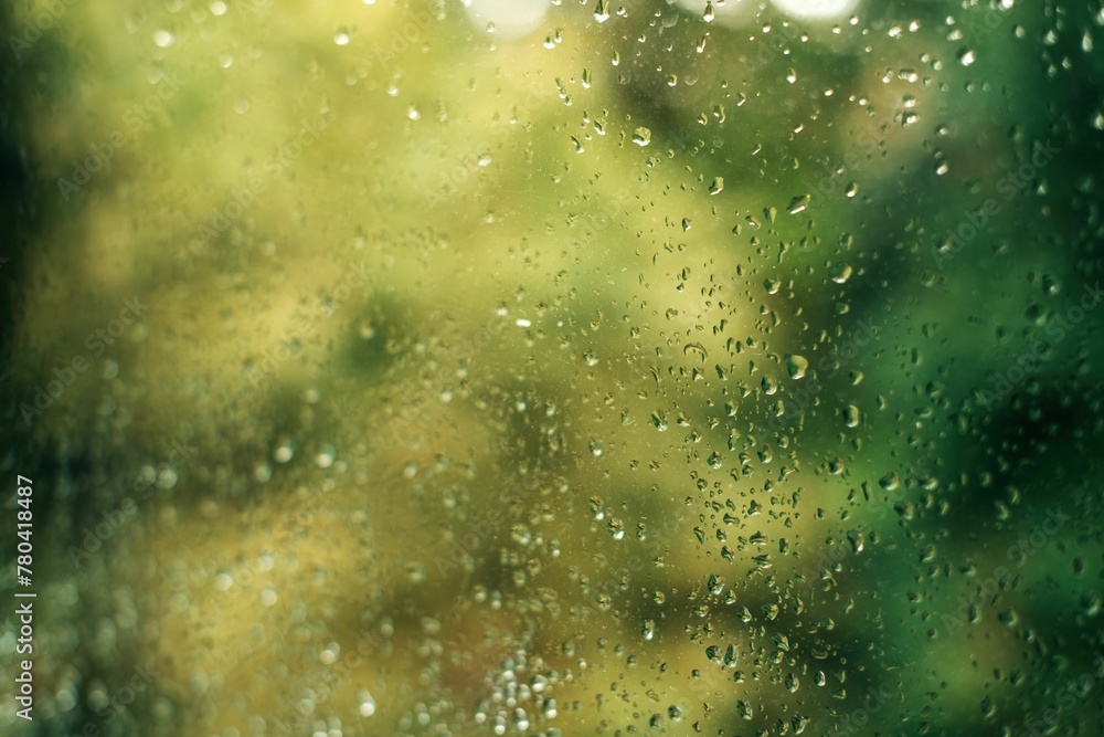 Closeup shot of a glass window with rain droplets