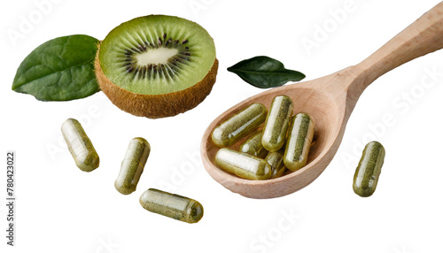 Supplements capsules in a wooden spoon. A cut green kiwi fruit is lying next to it. Cut out transparent white isolated background. Human health concept.