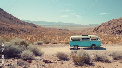 Vintage turquoise van stands in the solitude of a sprawling desert