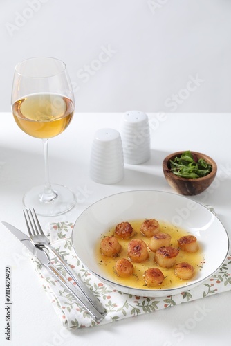 Delicious fried scallops served on white table