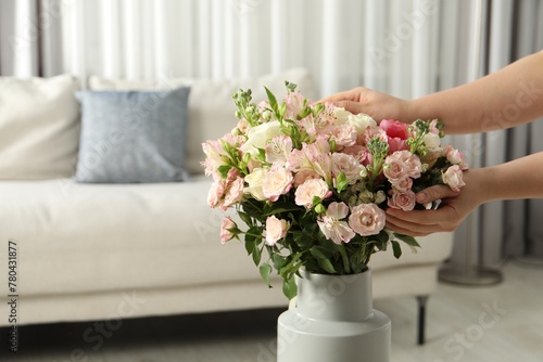 Woman with beautiful bouquet of fresh flowers at home, closeup. Space for text