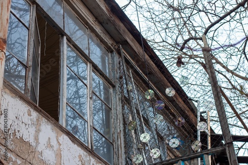 Outside of an art studio on the second floor with punk recycled decoration on the outside photo