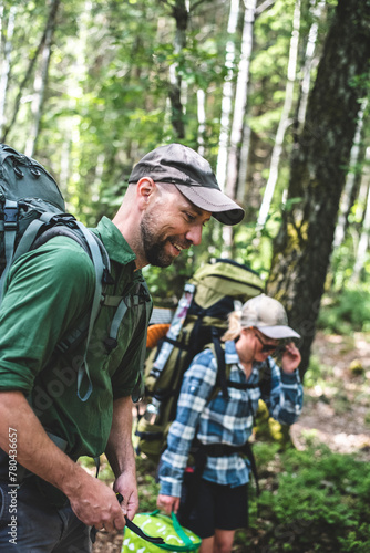 Wallpaper Mural Happy man hiking with partner in forest Torontodigital.ca