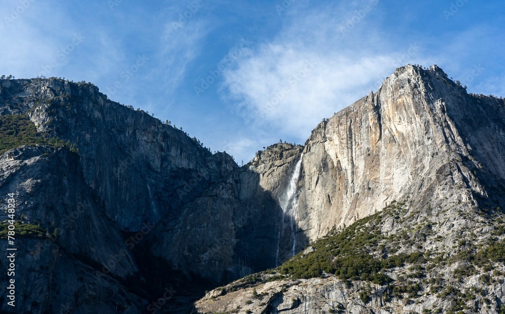 Scenic cliff under the sunlight reflection with a blue sky in the background Scenic cliff under the sunlight reflection with a blue sky in the background