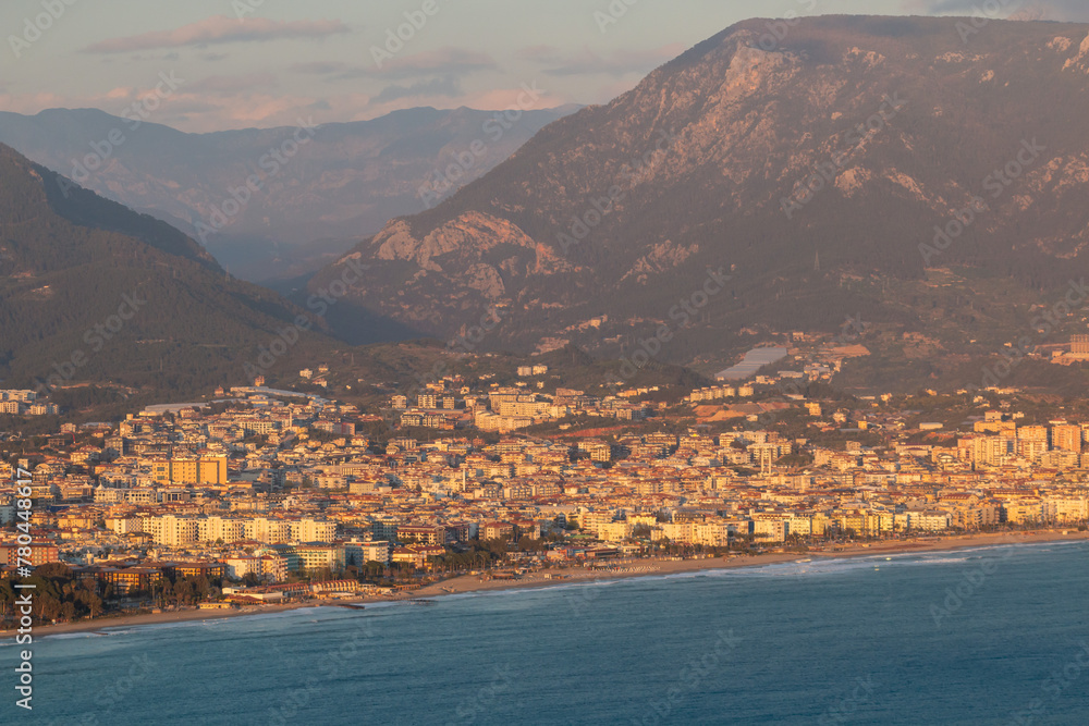 Panoramic view from Alanya Castle on city Buildings during sunset