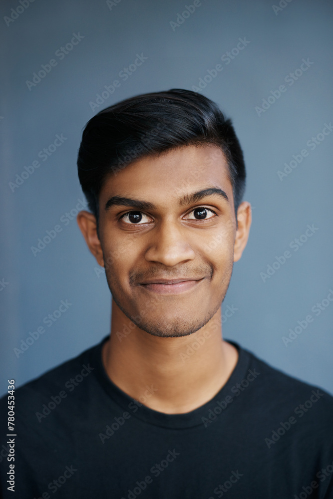 Smile, fashion and portrait of man in studio with positive, good and pride attitude with confidence. Happy, handsome and face of Indian male person with casual or trendy style by gray background. Smile, fashion and portrait of man in studio with positive, good and pride attitude with confidence. Happy, handsome and face of Indian male person with casual or trendy style by gray background.