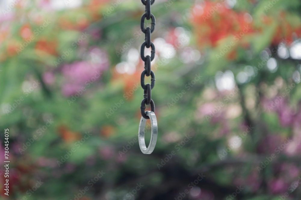 Closeup shot of a ring hung on a chain Closeup shot of a ring hung on a chain