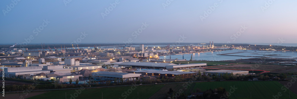 Aerial view of the industrial and port area of Ravenna ,chemical and petrochemical pole,thermoelectric,metallurgical plants and hydrocarbon refinery and liquefied natural gas tanks