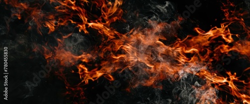 Fire burning flames on a black background, a fire texture for design. An isolated fire flame texture on a black background. An abstract fire wallpaper. A black background
